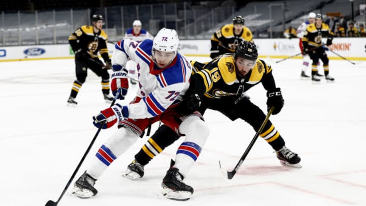 BOSTON, MASSACHUSETTS - MARCH 11: Filip Chytil #72 of the New York Rangers shields the puck from Zach Senyshyn #19 of the Boston Bruins during the second period at TD Garden on March 11, 2021 in Boston, Massachusetts. (Photo by Maddie Meyer/Getty Images)