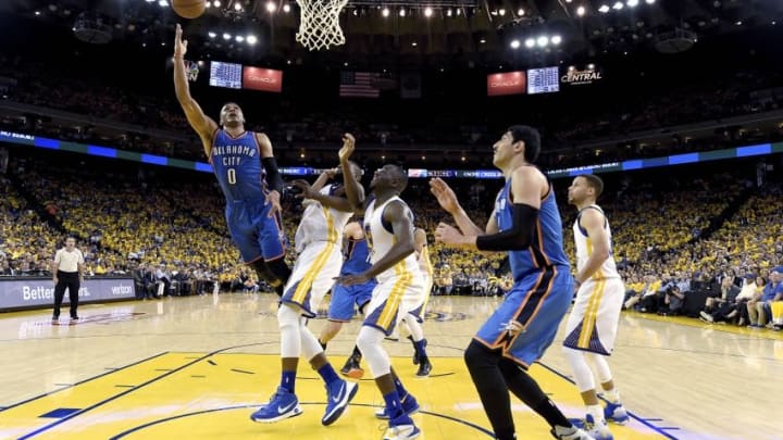 May 16, 2016; Oakland, CA, USA; Oklahoma City Thunder guard Russell Westbrook (0) shoots the basketball against the Golden State Warriors during the third quarter in game one of the Western conference finals of the NBA Playoffs at Oracle Arena. The Thunder defeated the Warriors 108-102. Mandatory Credit: Thearon W. Henderson-Pool Photo via USA TODAY Sports