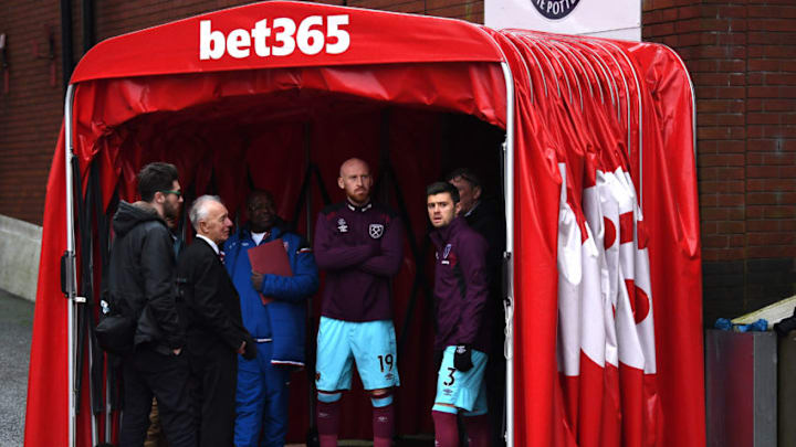 STOKE ON TRENT, ENGLAND - DECEMBER 16: James Collins of West Ham United and Aaron Cresswell of West Ham United wait in the tunnel as the game is delayed due to a powercut prior to the Premier League match between Stoke City and West Ham United at Bet365 Stadium on December 16, 2017 in Stoke on Trent, England. (Photo by Gareth Copley/Getty Images)