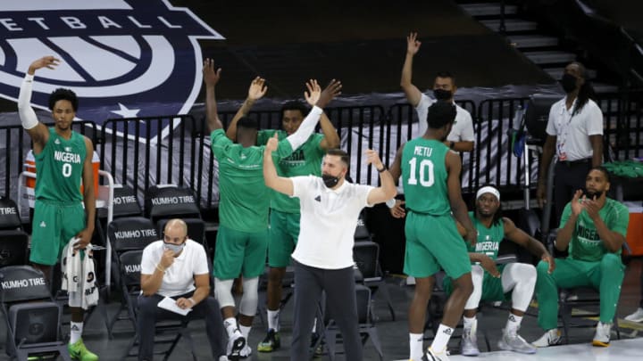 LAS VEGAS, NEVADA - JULY 10: The Nigeria bench reacts after Ike Iroegbu #1 of Nigeria hit a 3-pointer against the United States in the fourth quarter of an exhibition game at Michelob ULTRA Arena ahead of the Tokyo Olympic Games on July 10, 2021 in Las Vegas, Nevada. Nigeria defeated the United States 90-87. (Photo by Ethan Miller/Getty Images)