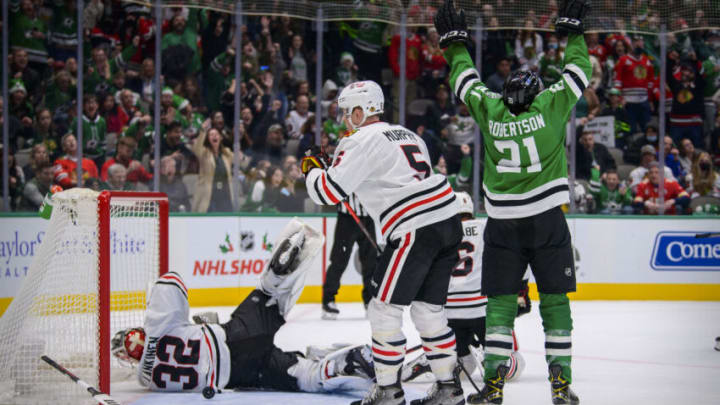 Dec 18, 2021; Dallas, Texas, USA; Dallas Stars left wing Jason Robertson (21) celebrates the game winning goal scored by defenseman John Klingberg (not pictured) against Chicago Blackhawks goaltender Kevin Lankinen (32) during the overtime period at the American Airlines Center. Mandatory Credit: Jerome Miron-USA TODAY Sports