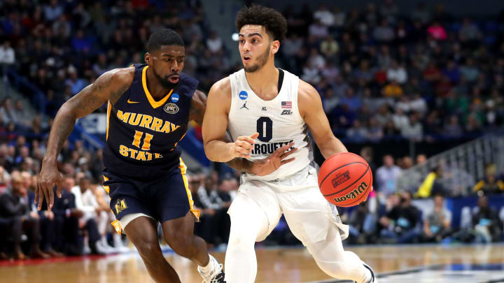 HARTFORD, CONNECTICUT – MARCH 21: Markus Howard #0 of the Marquette Golden Eagles is defended by Shaq Buchanan #11 of the Murray State Racers during the first round game of the 2019 NCAA Men’s Basketball Tournament at XL Center on March 21, 2019 in Hartford, Connecticut. (Photo by Maddie Meyer/Getty Images)