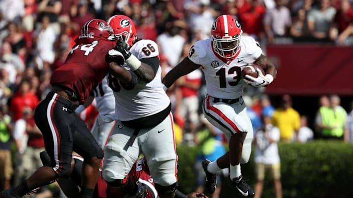 Elijah Holyfield #13 of the Georgia football Bulldogs runs with the ball against the South Carolina Gamecocks during their game at Williams-Brice Stadium on September 8, 2018 in Columbia, South Carolina. (Photo by Streeter Lecka/Getty Images)