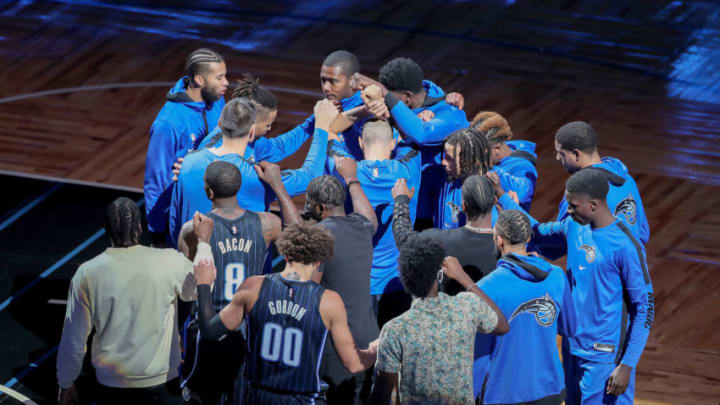 ORLANDO, FL - DECEMBER 31: Orlando Magic players huddle up against the Philadelphia 76ers at Amway Center on December 31, 2020 in Orlando, Florida. NOTE TO USER: User expressly acknowledges and agrees that, by downloading and or using this photograph, User is consenting to the terms and conditions of the Getty Images License Agreement. (Photo by Alex Menendez/Getty Images)