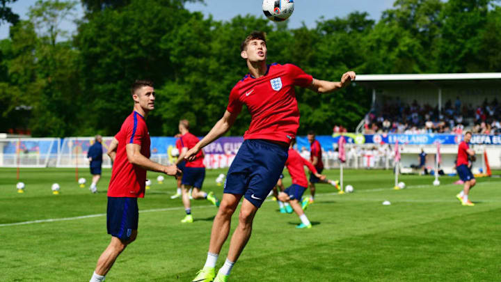 CHANTILLY, FRANCE - JUNE 07: John Stones heads the ball during an England training session ahead of the UEFA EURO 2016 at Stade du Bourgognes on June 7, 2016 in Chantilly, France. England's opening match at the European Championship is against Russia on June 11. (Photo by Dan Mullan/Getty Images)