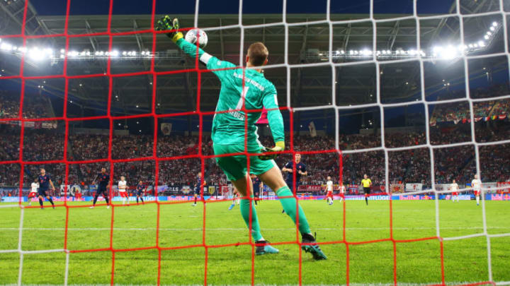 LEIPZIG, GERMANY – SEPTEMBER 14: Manuel Neuer of FC Bayern Munich makes a spectacular save during the Bundesliga match between RB Leipzig and FC Bayern Muenchen at Red Bull Arena on September 14, 2019 in Leipzig, Germany. (Photo by Alexander Hassenstein/Bongarts/Getty Images)
