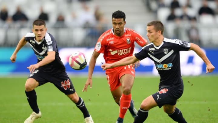 Bordeaux's Spanish defender Sergi Palencia (L), Bordeaux's French forward Nicolas De Preville (R) and Caen's French defender Yoel Armougom (C) vies for the ball during the French Ligue 1 football match between Bordeaux and Caen on November 11, 2018 at the Matmut Atlantique stadium in Bordeaux, southwestern France. (Photo by NICOLAS TUCAT / AFP) (Photo credit should read NICOLAS TUCAT/AFP/Getty Images)