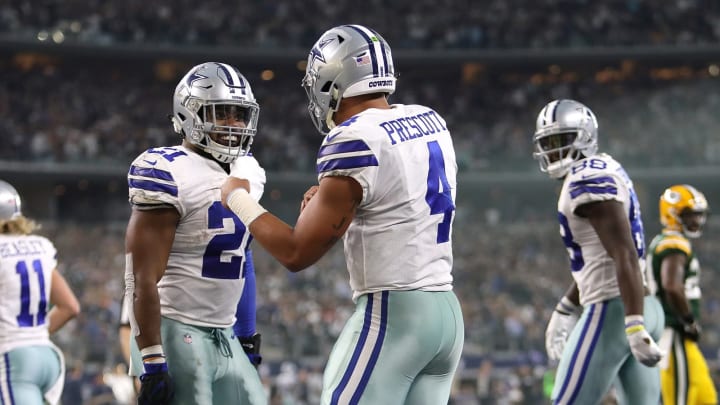 ARLINGTON, TX – OCTOBER 08: Dak Prescott #4 celebrates his touchdown run with Ezekiel Elliott #21 of the Dallas Cowboys in the fourth quarter against the Green Bay Packers at AT&T Stadium on October 8, 2017 in Arlington, Texas. (Photo by Ronald Martinez/Getty Images)