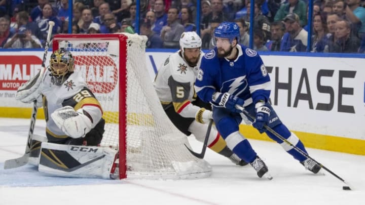 TAMPA, FL - FEBRUARY 05: Vegas Golden Knights defenseman Deryk Engelland (5) chases Tampa Bay Lightning right wing Nikita Kucherov (86) around the back of the net during the NHL Hockey match between the Tampa Bay Lightning and Vegas Golden Nights on February 05, 2019, at Amalie Arena in Tampa, FL. (Photo by Andrew Bershaw/Icon Sportswire via Getty Images)