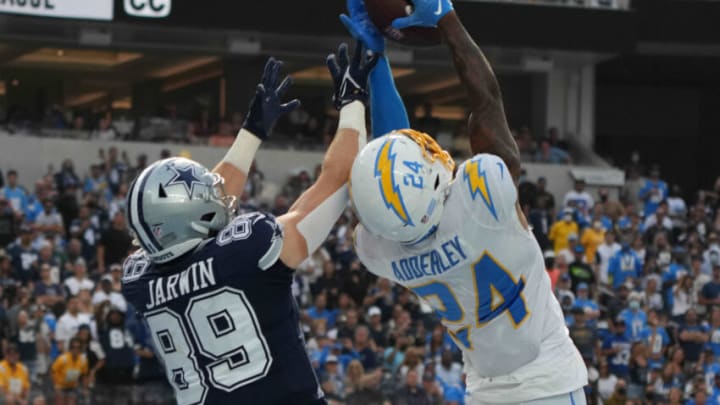 Sep 19, 2021; Inglewood, California, USA; Los Angeles Chargers defensive back Nasir Adderley (24) breaks up a pass intended for Dallas Cowboys tight end Blake Jarwin (89) in the fourth quarter at SoFi Stadium. Mandatory Credit: Kirby Lee-USA TODAY Sports