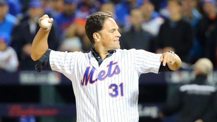 Oct 30, 2015; New York City, NY, USA; New York Mets former catcher Mike Piazza throws out the ceremonial first pitch before game three of the World Series against the Kansas City Royals at Citi Field. Mandatory Credit: Anthony Gruppuso-USA TODAY Sports