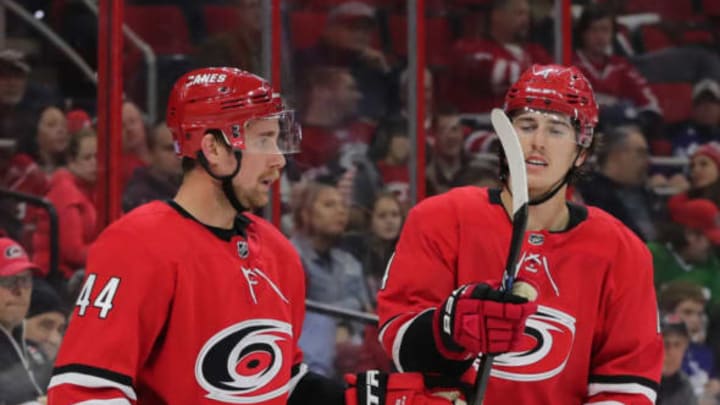 RALEIGH, NC – NOVEMBER 21: Carolina Hurricanes defenseman Calvin de Haan (44) gives Carolina Hurricanes defenseman Haydn Fleury (4) his stick during the 3rd period of the Carolina Hurricanes game versus the Toronto Maple Leafs on November 21st, 2018 at PNC Arena in Raleigh, NC. (Photo by Jaylynn Nash/Icon Sportswire via Getty Images)