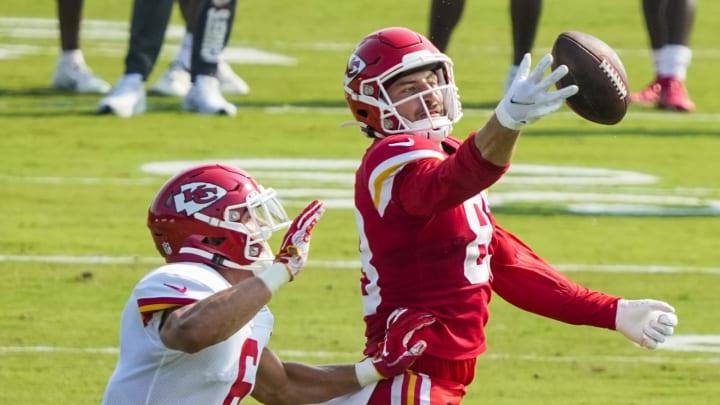 Aug 3, 2021; St. Joseph, Missouri, USA; Kansas City Chiefs tight end Noah Gray (83) reaches for the ball as defensive back Zayne Anderson (6) defends during training camp at Missouri Western State University. Mandatory Credit: Jay Biggerstaff-USA TODAY Sports