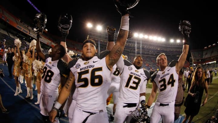 Oct 18, 2014; Gainesville, FL, USA; Missouri Tigers defensive lineman Shane Ray (56), wide receiver Jimmie Hunt (88), offensive lineman Evan Boehm (77), safety Chaston Ward (13) and teammates celebrate after they beat the Florida Gators during the second half at Ben Hill Griffin Stadium. Missouri Tigers defeated the Florida Gators 42-13. Mandatory Credit: Kim Klement-USA TODAY Sports