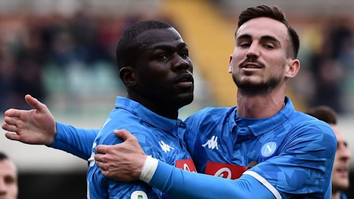 Napoli's Senegalese defender Kalidou Koulibaly (L) celebrates wit Napoli's Spanish midfielder Fabian Ruiz after opening the scoring during the Italian Serie A football match Chievo Verona vs Napoli on April, 2019 at the Marcantonio-Bentegodi stadium in Verona. (Photo by Marco Bertorello / AFP) (Photo credit should read MARCO BERTORELLO/AFP via Getty Images)