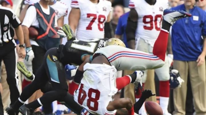 New York Giants tight end Larry Donnell (84) fumbles the ball after being hit by Jacksonville Jaguars cornerback Dwayne Gratz (27) during the fourth quarter at EverBank Field. The Jaguars won 25-24. Mandatory Credit: Tommy Gilligan-USA TODAY Sports