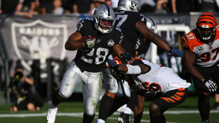 OAKLAND, CALIFORNIA – NOVEMBER 17: Josh Jacobs #28 of the Oakland Raiders rushes against the Cincinnati Bengals during their NFL game at RingCentral Coliseum on November 17, 2019 in Oakland, California. (Photo by Robert Reiners/Getty Images)