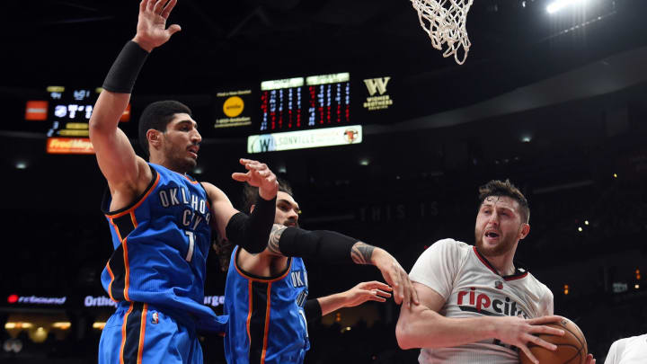 Mar 2, 2017; Portland, OR, USA; Portland Trail Blazers center Jusuf Nurkic (27) grabs a rebound in front of Oklahoma City Thunder center Enes Kanter (11) and center Steven Adams (12) during the second half of the game at Moda Center. The Blazers won 114-109. Mandatory Credit: Steve Dykes-USA TODAY Sports