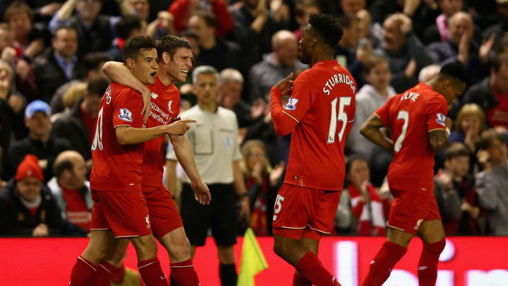 LIVERPOOL, ENGLAND – APRIL 20: Philippe Coutinho of Liverpool celebrates with James Milner of Liverpool and Daniel Sturridge of Liverpool after scoring his sides fourth goal during the Barclays Premier League match between Liverpool and Everton at Anfield, April 20, 2016, Liverpool, England (Photo by Clive Brunskill/Getty Images)