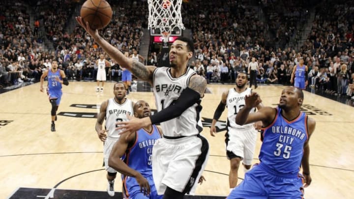 May 2, 2016; San Antonio, TX, USA; San Antonio Spurs shooting guard Danny Green (14) shoots the ball past Oklahoma City Thunder small forward Kevin Durant (35) in game two of the second round of the NBA Playoffs at AT&T Center. Mandatory Credit: Soobum Im-USA TODAY Sports