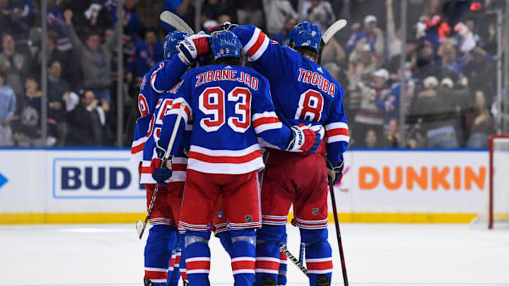 May 11, 2022; New York, New York, USA; New York Rangers celebrate the empty net goal by defenseman Ryan Lindgren (55) against the Pittsburgh Penguins during the third period in game five of the first round of the 2022 Stanley Cup Playoffs at Madison Square Garden. Mandatory Credit: Dennis Schneidler-USA TODAY Sports