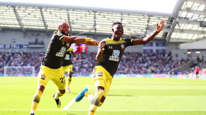 BRIGHTON, ENGLAND - AUGUST 24: Moussa Djenepo of Southampton celebrates with teammate Nathan Redmond of Southampton after scoring their teams first goal during the Premier League match between Brighton & Hove Albion and Southampton FC at American Express Community Stadium on August 24, 2019 in Brighton, United Kingdom. (Photo by Dan Istitene/Getty Images)