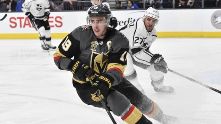 LAS VEGAS, NV - FEBRUARY 27: Reilly Smith #19 of the Vegas Golden Knights skates with the puck while Alec Martinez #27 of the Los Angeles Kings defends during the game at T-Mobile Arena on February 27, 2018 in Las Vegas, Nevada. (Photo by Jeff Bottari/NHLI via Getty Images)
