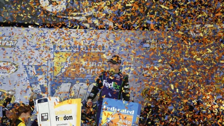 Sep 10, 2016; Richmond, VA, USA; Sprint Cup Series driver Denny Hamlin (11) celebrates in victory lane after winning the Federated Auto Parts 400 at Richmond International Raceway. Mandatory Credit: Amber Searls-USA TODAY Sports