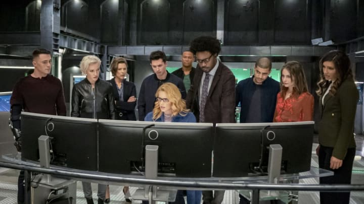 Arrow — “Fadeout” — Image Number: AR810B_0438b.jpg — Pictured (L-R): Colton Haynes as Roy Harper, Katie Cassidy as Laurel Lance/Black Siren, Audrey Marie Anderson as Lyla Michaels, Joe Dinicol as Rory Regan/Ragman, Emily Bett Rickards as Felicity Smoak, David Ramsey as John Diggle/Spartan, Echo Kellum as Curtis Holt/Mr. Terrific, Rick Gonzalez as Rene Ramirez/Wild Dog, Willa Holland as Thea Queen and Juliana Harkavy as Dinah Drake/Black Canary — Photo: Colin Bentley/The CW — © 2020 The CW Network, LLC. All Rights Reserved.