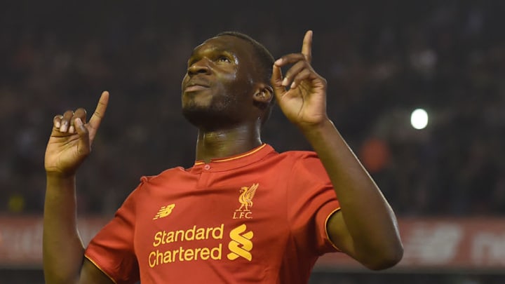 Liverpool's Christian Benteke celebrates after scoring his team's first goal during the English Premier League football match between Liverpool and Chelsea at Anfield in Liverpool, north west England on May 11, 2016. / AFP / PAUL ELLIS / RESTRICTED TO EDITORIAL USE. No use with unauthorized audio, video, data, fixture lists, club/league logos or 'live' services. Online in-match use limited to 75 images, no video emulation. No use in betting, games or single club/league/player publications. / (Photo credit should read PAUL ELLIS/AFP/Getty Images)