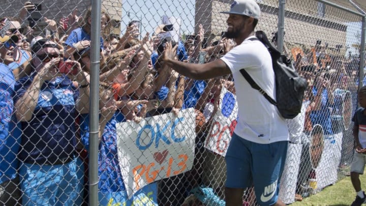 OKLAHOMA CITY, OK - JULY 11: Paul George of the Oklahoma City Thunder is greeted by Thunder fans on July 11, 2017 at the Will Rogers Airport in Oklahoma City, Oklahoma. The Thunder acquired George from the Indiana Pacers in a trade. NOTE TO USER: User expressly acknowledges and agrees that, by downloading and or using this Photograph, user is consenting to the terms and conditions of the Getty Images License Agreement. Mandatory Copyright Notice: Copyright 2017 NBAE (Photo by Layne Murdoch/NBAE via Getty Images)