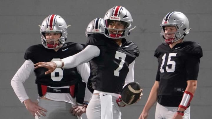 Ohio State Buckeyes quarterback C.J. Stroud (7) takes a snap in front of quarterbacks Chad Ray (19), Kyle McCord (6), Devin Brown (15) and their coach Corey Dennis during a spring football practice at the Woody Hayes Athletics Center in Columbus on March 22, 2022.Ncaa Football Ohio State Spring Practice