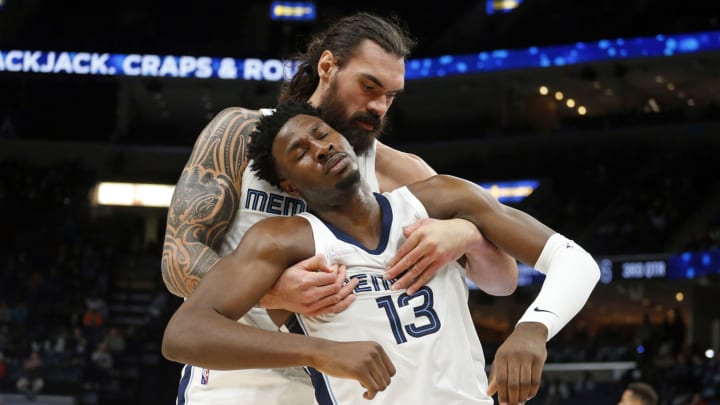 Memphis Grizzles forward Jaren Jackson Jr. pretends to play dead as center Steven Adams lifts him up. Mandatory Credit: Petre Thomas-USA TODAY Sports