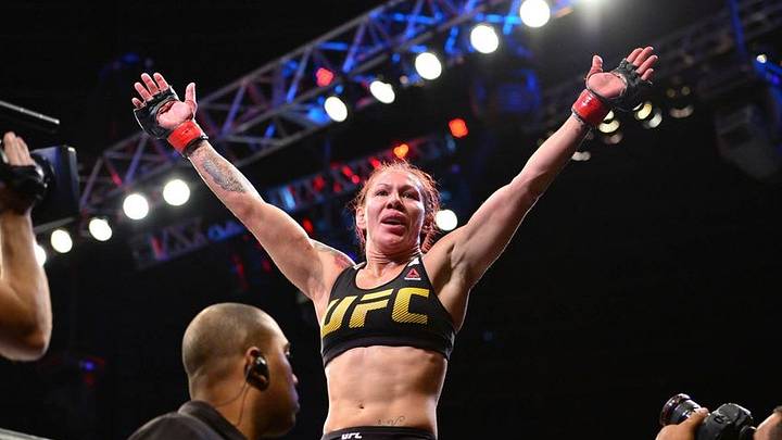 Sep 24, 2016; Brasilia, Brazil; Cris Cyborg (red gloves) celebrates defeating Lina Lansberg (blue gloves) during UFC Fight Night at Nilson Nelson Gymnasium. Mandatory Credit: Jason Silva-USA TODAY Sports