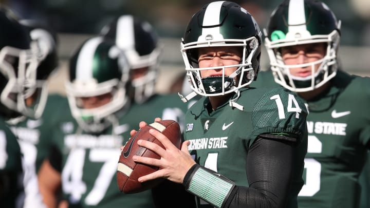 EAST LANSING, MI – OCTOBER 20: Brian Lewerke #14 of the Michigan State Spartans warms up prior to playing the Michigan Wolverines at Spartan Stadium on October 20, 2018 in East Lansing, Michigan. (Photo by Gregory Shamus/Getty Images)