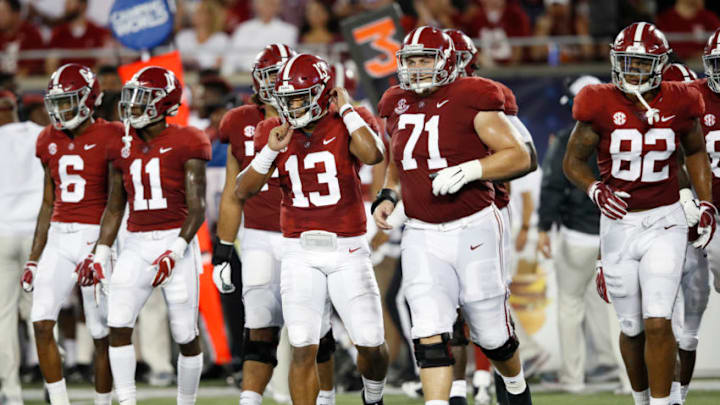ORLANDO, FL - SEPTEMBER 01: Tua Tagovailoa #13 of the Alabama Crimson Tide leads his teammates onto the field during a game against the Louisville Cardinals at Camping World Stadium on September 1, 2018 in Orlando, Florida. Alabama won 51-14. (Photo by Joe Robbins/Getty Images)