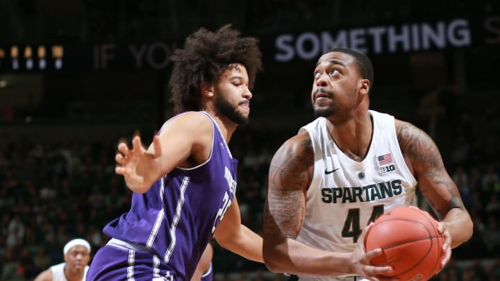 EAST LANSING, MI – JANUARY 02: Nick Ward #44 of the Michigan State Spartans handles the ball while defended by Barret Benson #25 of the Northwestern Wildcats in the first half at Breslin Center on January 2, 2019 in East Lansing, Michigan. (Photo by Rey Del Rio/Getty Images)