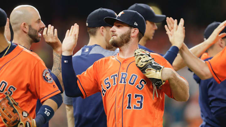 HOUSTON, TX - AUGUST 04: Tyler White #13 of the Houston Astros high fives his teammates as the Houston Astros defeated the Toronto Blue Jays 16-7 at Minute Maid Park on August 4, 2017 in Houston, Texas. (Photo by Bob Levey/Getty Images)