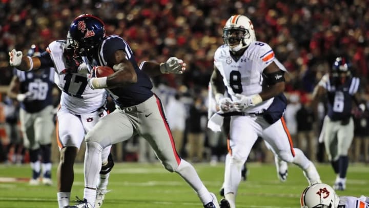 Nov 1, 2014; Oxford, MS, USA; Ole Miss Rebels wide receiver Laquon Treadwell (1) runs the ball prior to his season-ending injury during the fourth quarter while defended by Auburn Tigers linebacker Kris Frost (17) and linebacker Cassanova McKinzy (8) at Vaught-Hemingway Stadium. Auburn won 35-31. Mandatory Credit: Shanna Lockwood-USA TODAY Sports