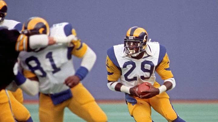 PITTSBURGH, PA – SEPTEMBER 16: Running back Eric Dickerson #29 of the Los Angeles Rams runs with the football against the Pittsburgh Steelers as tight end David Hill #81 blocks during a game at Three Rivers Stadium on September 16, 1984 in Pittsburgh, Pennsylvania. The Steelers defeated the Rams 24-14. (Photo by George Gojkovich/Getty Images)