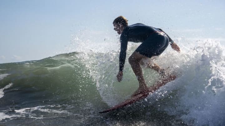 USA's John John Florence rides a wave during a free training session of the Tokyo 2020 Olympic Games at the Tsurigasaki Surfing Beach, in Chiba, on July 24, 2021. (Photo by Olivier MORIN / POOL / AFP) (Photo by OLIVIER MORIN/POOL/AFP via Getty Images)