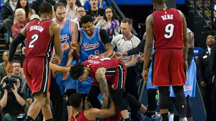 Apr 1, 2016; Sacramento, CA, USA; Miami Heat center Hassan Whiteside (21) gets fouled as forward Gerald Green (14) helps and Sacramento Kings forward Rudy Gay (8) reacts in a pushing match that resulted in a technical foul in the fourth quarter at Sleep Train Arena. Miami won 112-106. Mandatory Credit: John Hefti-USA TODAY Sports