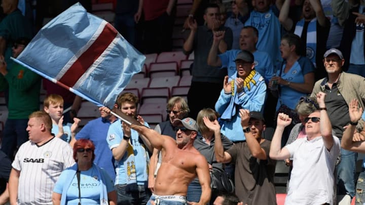 BOURNEMOUTH, ENGLAND - AUGUST 26: Manchester City fans celebrate their sides goal during the Premier League match between AFC Bournemouth and Manchester City at Vitality Stadium on August 26, 2017 in Bournemouth, England. (Photo by Mike Hewitt/Getty Images)