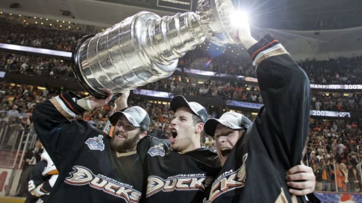 Ducks teammates from left, Dustin Penner, Ryan Getzlafand Corey Perry hoist the Stanley Cup after beating the Otawa Senators in game 5. The Anaheim Ducks became the first West Coast team to win the Stanley Cup after beating the Ottawa Senators 6?2 in game five at the Honda Center in Anaheim. (Photo by Wally Skalij/Los Angeles Times via Getty Images)