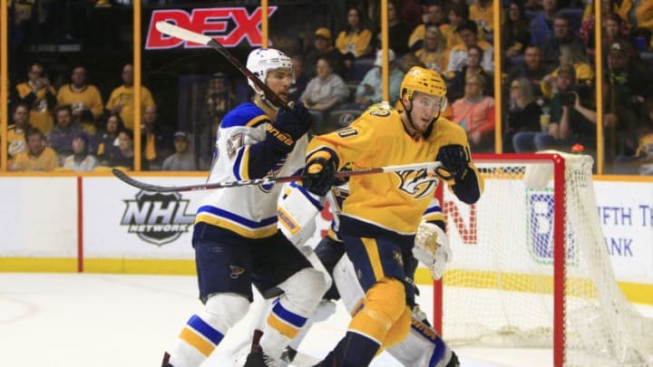 NASHVILLE, TN - FEBRUARY 25: Nashville Predators center Colton Sissons (10) and St. Louis Blues defenseman Alex Pietrangelo (27) react to a deflected puck during the NHL game between the Nashville Predators and the St. Louis Blues, held on February 25, 2018, at Bridgestone Arena in Nashville, Tennessee. (Photo by Danny Murphy/Icon Sportswire via Getty Images)