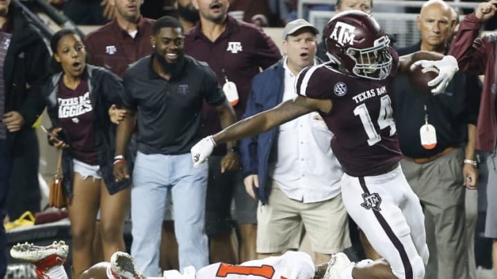 COLLEGE STATION, TX - SEPTEMBER 08: Camron Buckley #14 of the Texas A&M Aggies is tackled by K'Von Wallace #12 of the Clemson Tigers at Kyle Field on September 8, 2018 in College Station, Texas. (Photo by Bob Levey/Getty Images)