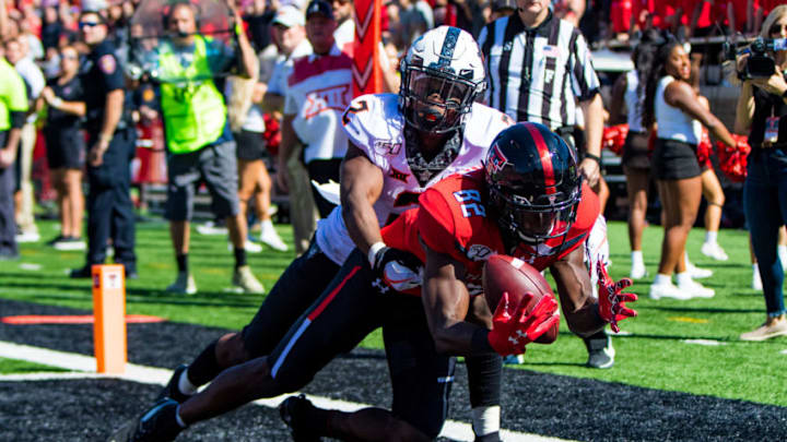 LUBBOCK, TEXAS - OCTOBER 05: Wide receiver KeSean Carter #82 of the Texas Tech Red Raiders catches a touchdown pass during the first half of the college football game between the Texas Tech Red Raiders and the Oklahoma State Cowboys on October 05, 2019 at Jones AT&T Stadium in Lubbock, Texas. (Photo by John E. Moore III/Getty Images)