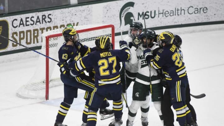 Wolverine and Spartan rivals scuffle on the ice Friday, Feb. 10, 2023, at Munn Ice Arena during the first period at Munn Ice Arena. U-M defeated MSU 4-2.Dsc 3621