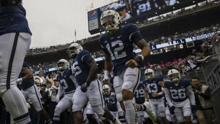 STATE COLLEGE, PA - OCTOBER 23: Brandon Smith #12 of the Penn State Nittany Lions takes the field with teammates before the game against the Illinois Fighting Illini at Beaver Stadium on October 23, 2021 in State College, Pennsylvania. (Photo by Scott Taetsch/Getty Images)