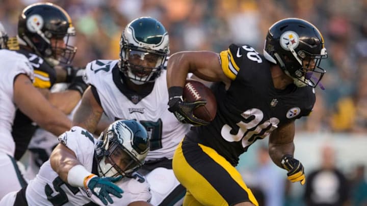 PHILADELPHIA, PA - AUGUST 09: James Conner #30 of the Pittsburgh Steelers runs past Kamu Grugier-Hill #54 of the Philadelphia Eagles in the first quarter during the preseason game at Lincoln Financial Field on August 9, 2018 in Philadelphia, Pennsylvania. (Photo by Mitchell Leff/Getty Images)